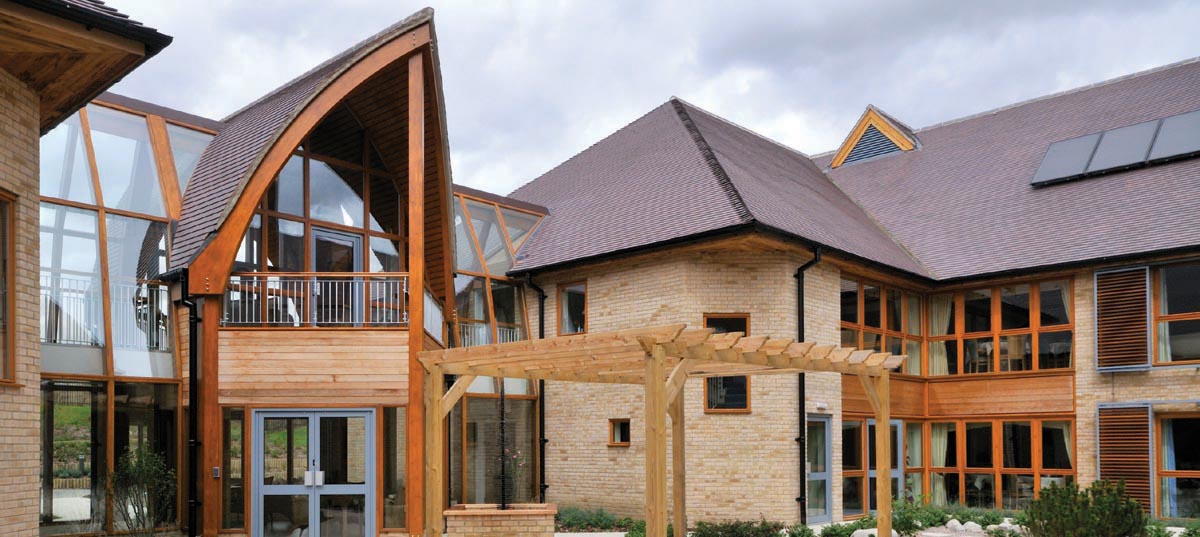 This contemporary award winning carehome uses traditional plain blue brindle roof tiles