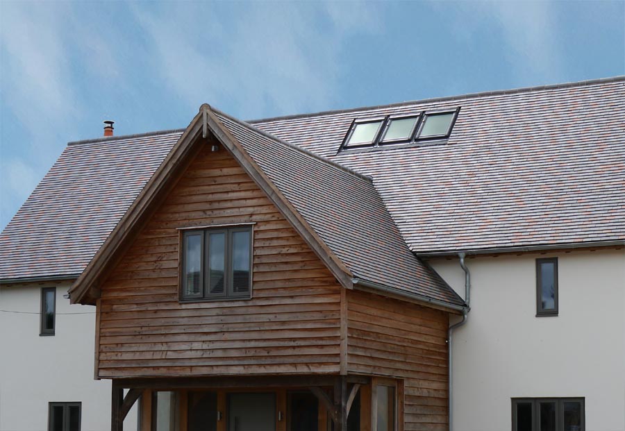a blend of smoothfaced clay tiles 70 Blue Brindle with 15red and 15 country brown