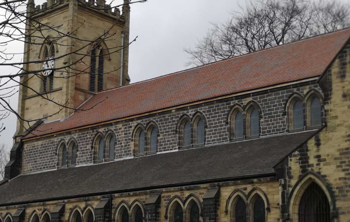 purple brown handmade clay roof tiles at St Margarets Church in Swinton
