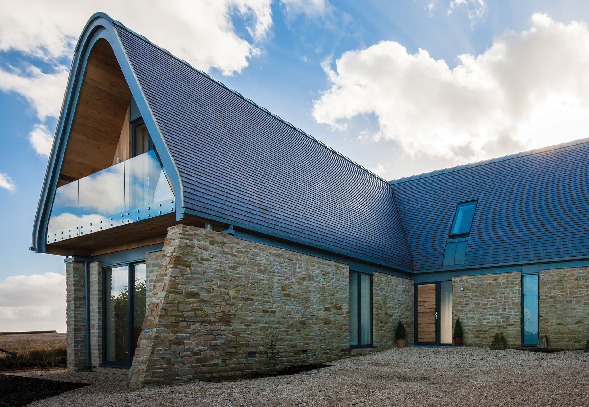 A comtemporary rural dwelling with a staffordshire blue roof