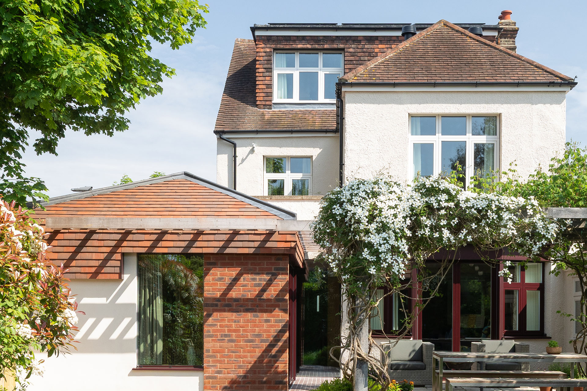 a renovation by Polescuk Architects uses brown antique sandfaced clay tiles