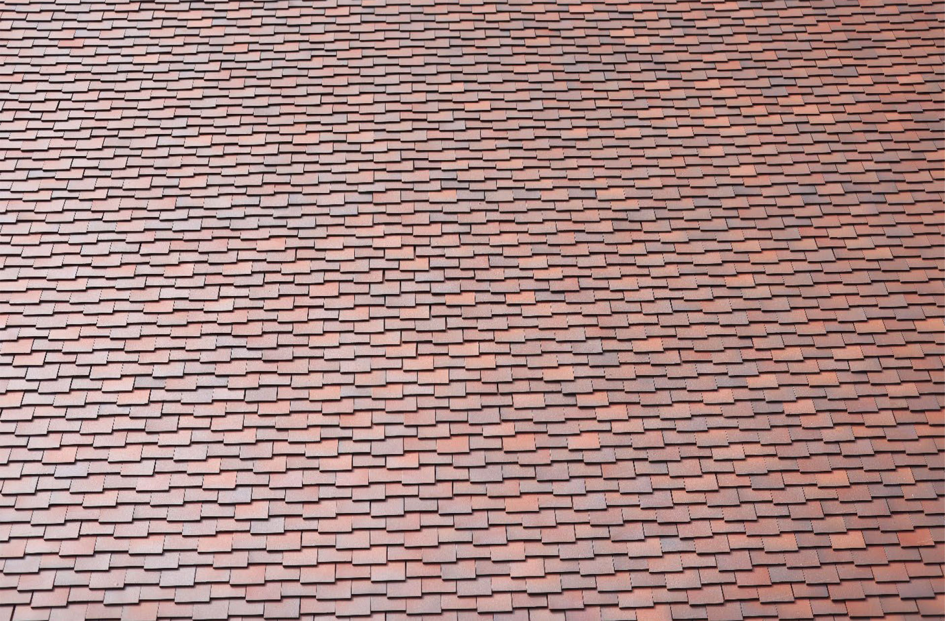 close up of countrybrown smooth plain and bespoke clay tiles at St Lukes Chapel Melbourne