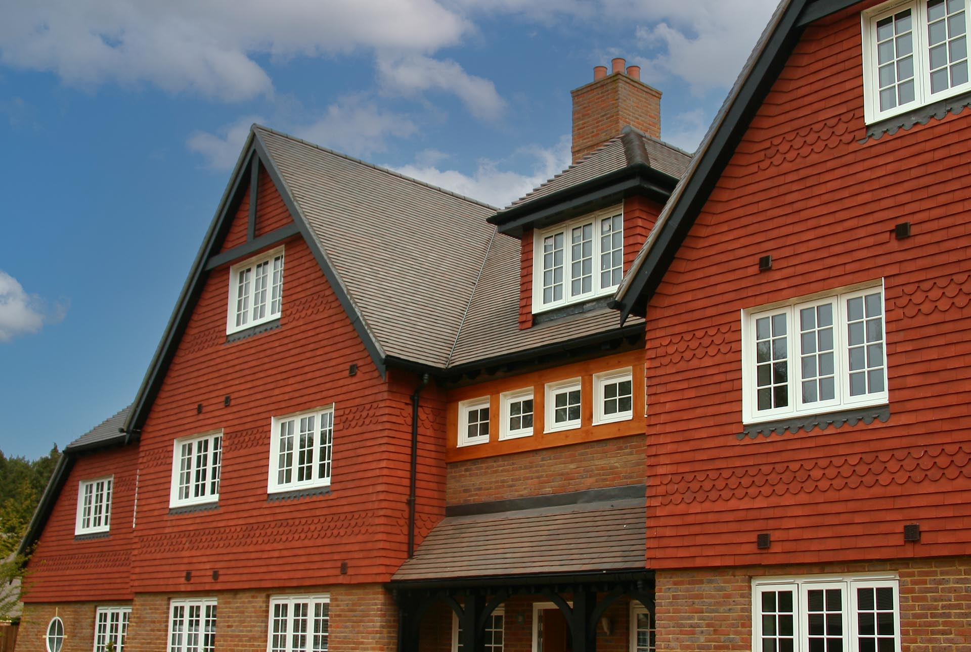 Elvira Homes luxury small development in Kingswood Surrey with Dreadnought red rustic vertical tiles