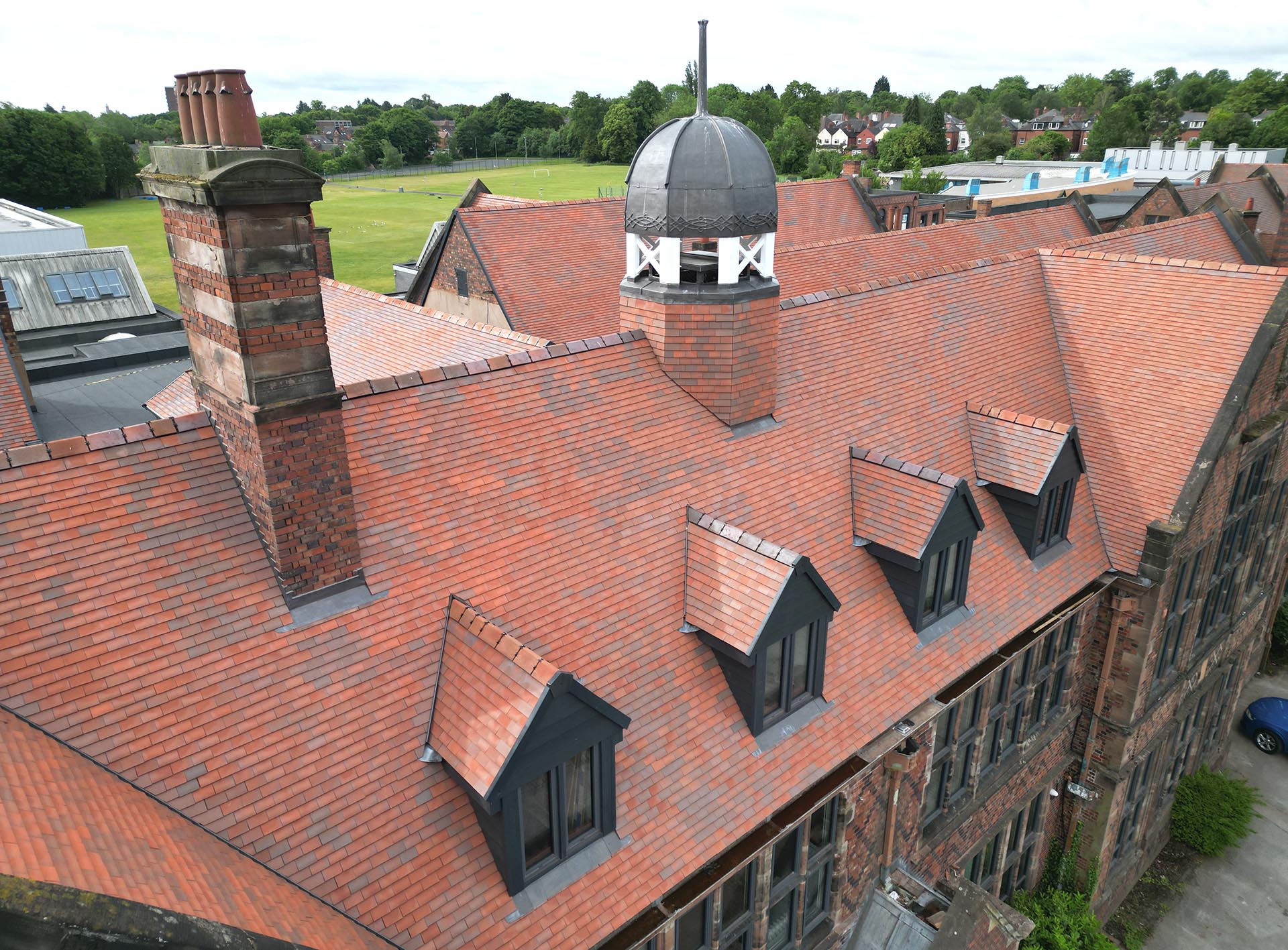 George Dixon Academy reroofed by NRA Roofing using Dreadnought brown antique clay tiles