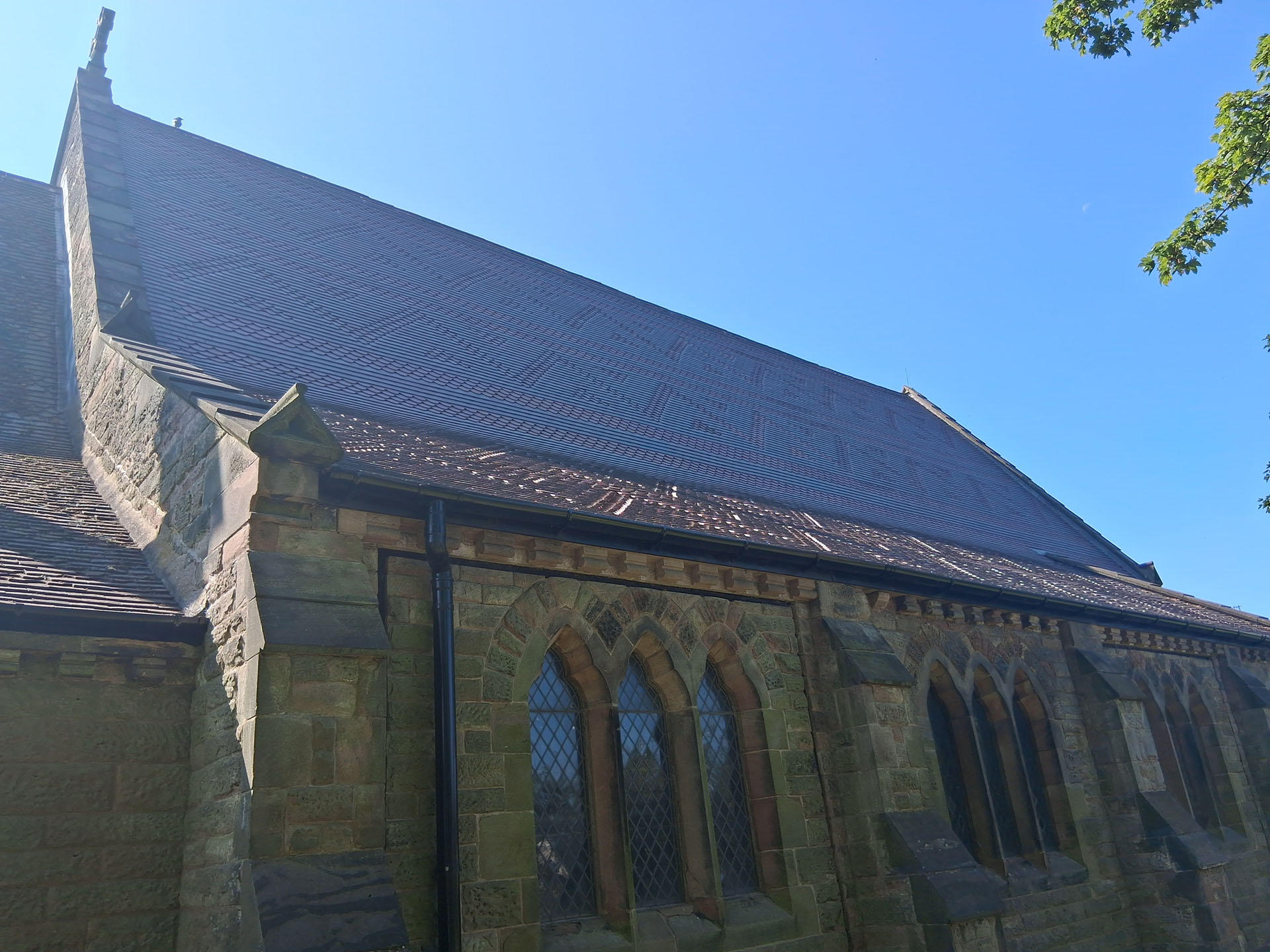 New church roof with Dreadnought Staffs blue rustic tiles and blue brindle ornamentals
