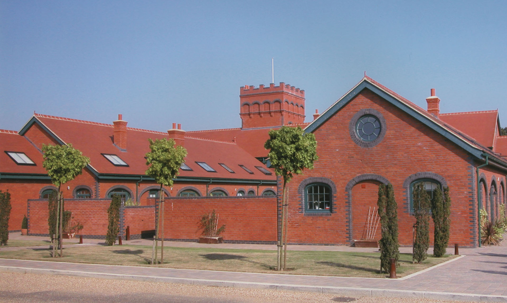 Plum Red tiles with made to order crested ridges and finials