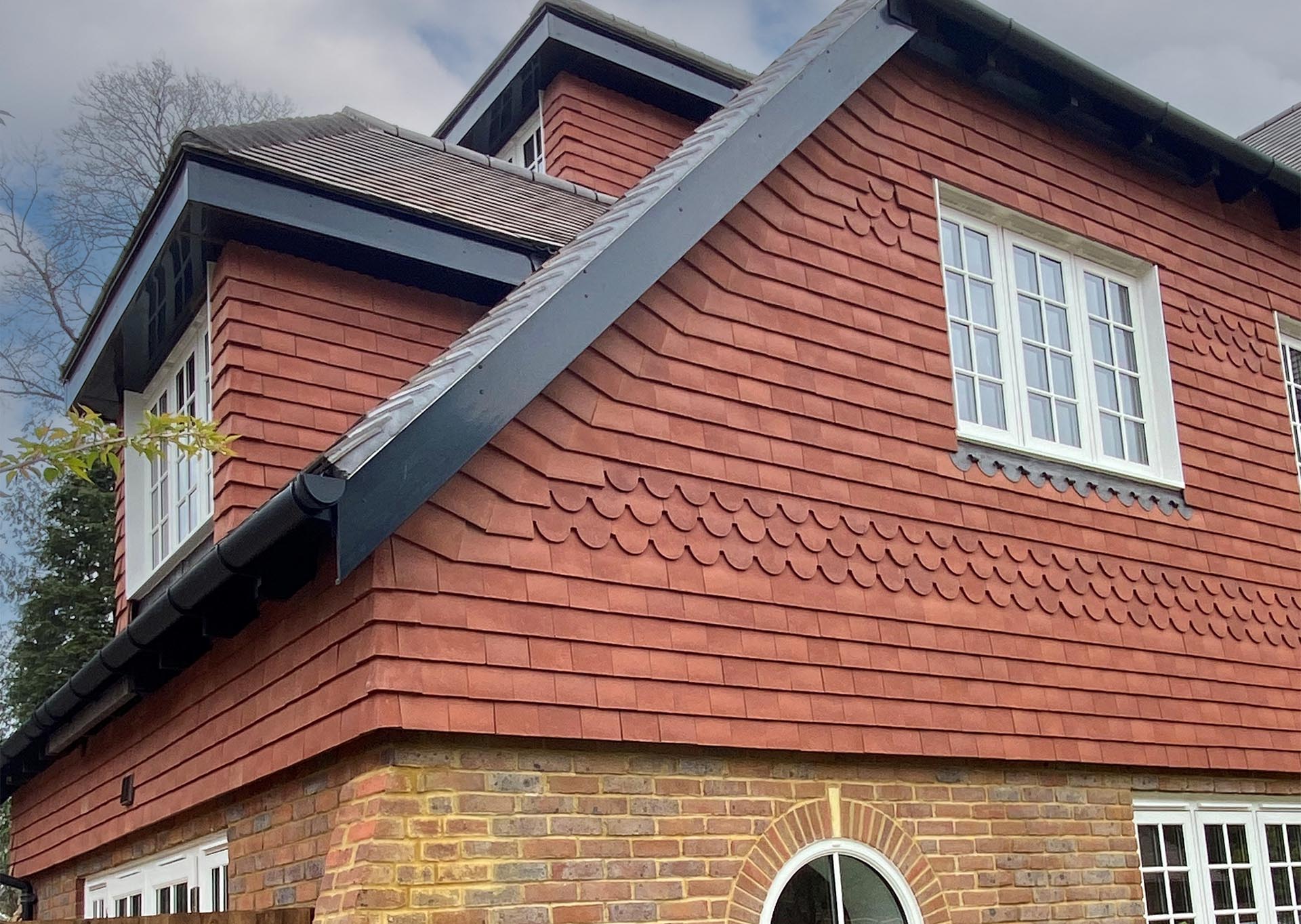 Rustic red vertical tile details at Elivia Homes development in Surrey