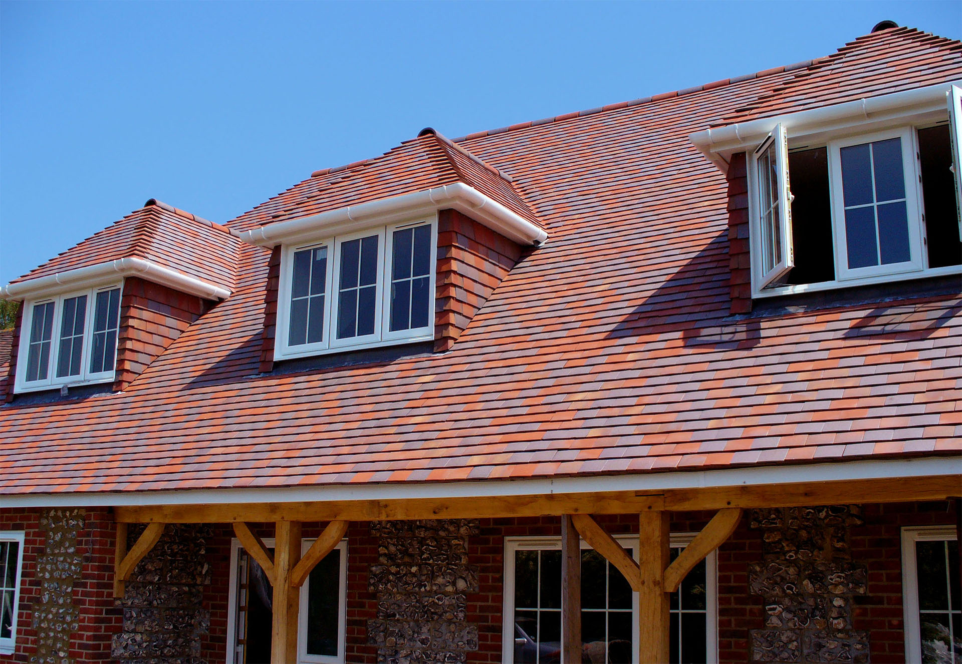 Sandfaced Dreadnought Nelson blend tiles on a roof in Winchester