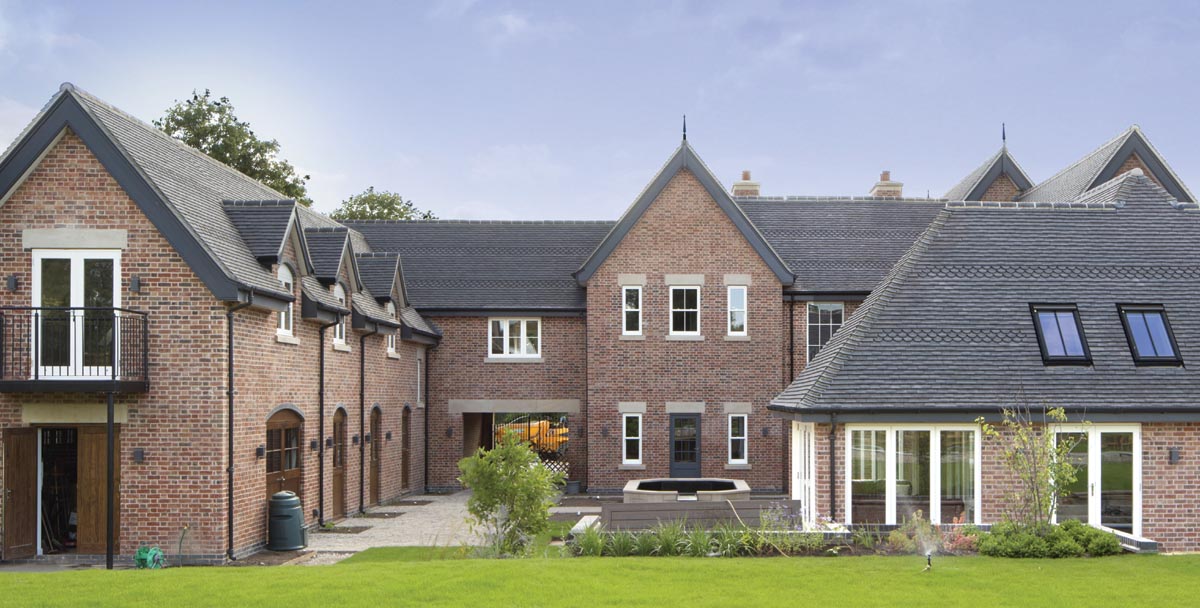 Staffordshire blue clay Rustic plain tiles with bands of ornamental spade tiles