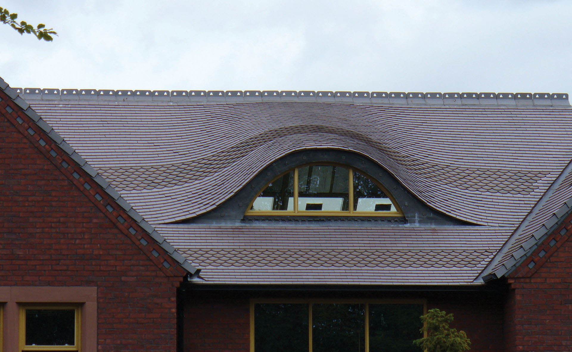 This eyebrow dormer adds detail to the roofline while bringing in light