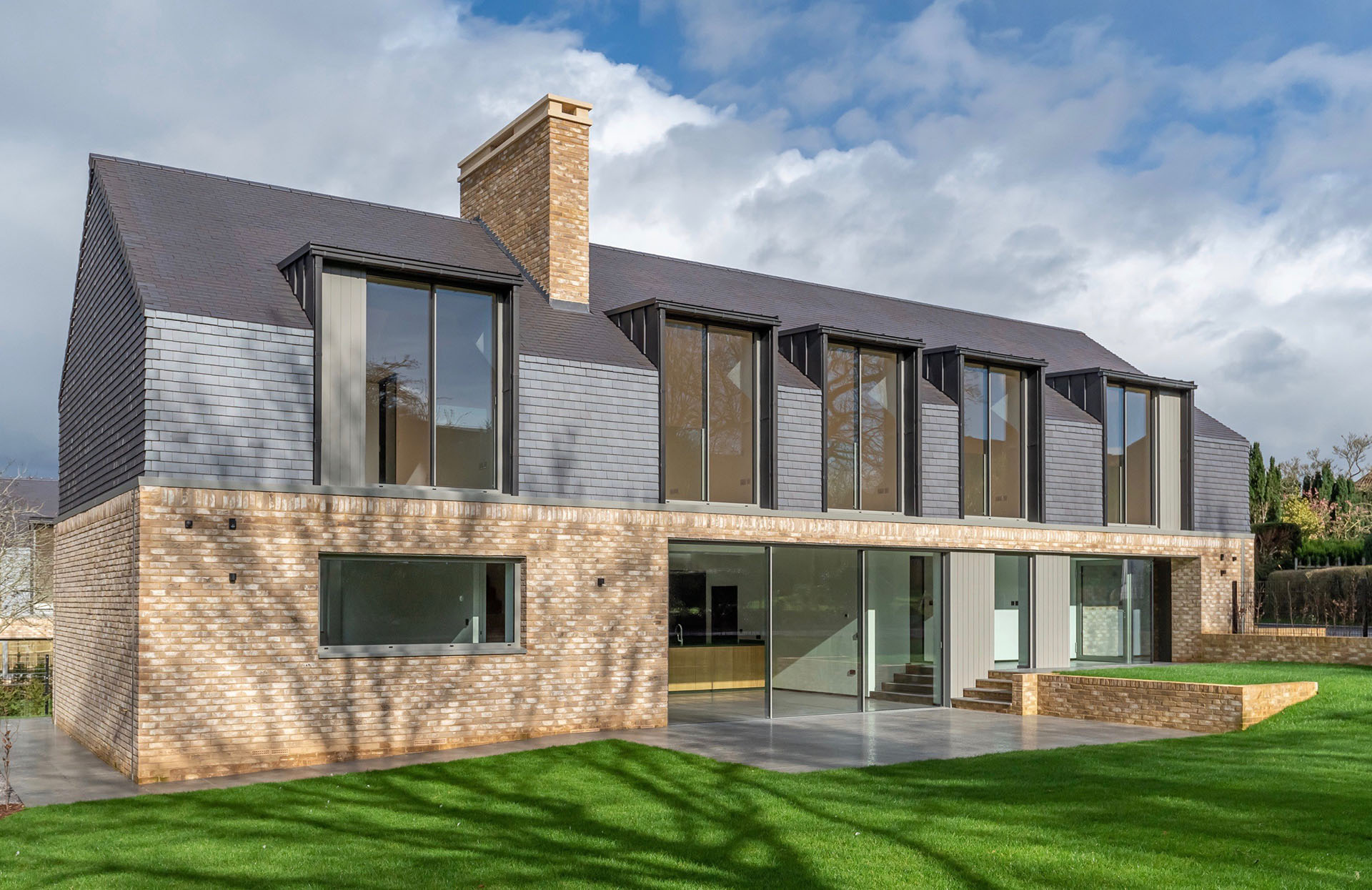 a beautiful contemporary home with staffs blue tiles by Sabatini Homes