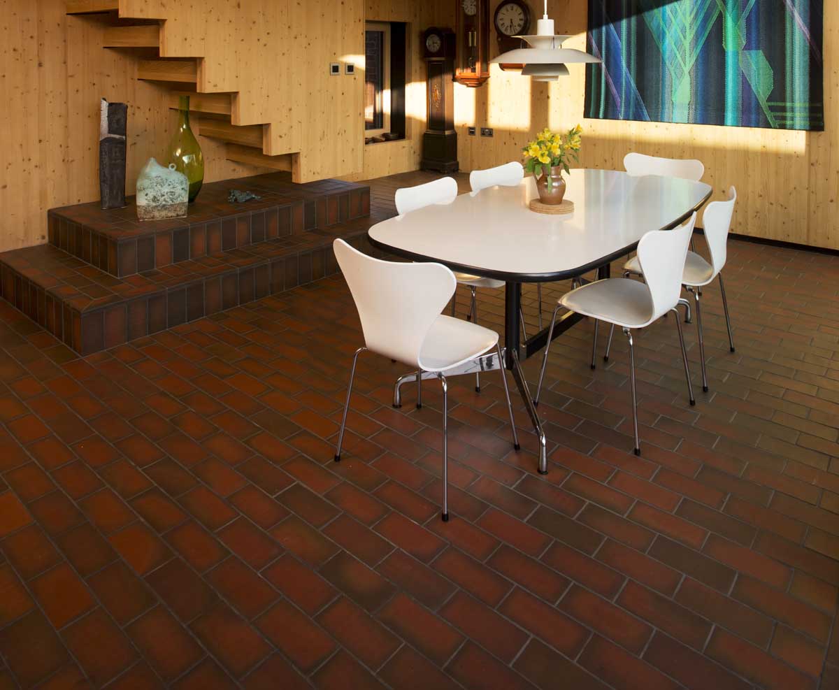 a blend of dark and light multi quarry tiles at a Passiv house in Hampshrie