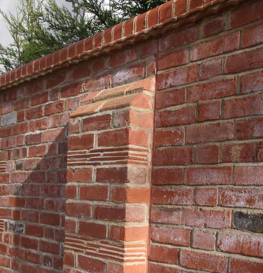 a combination of plain tiles and creasing tiles add detail to this wall