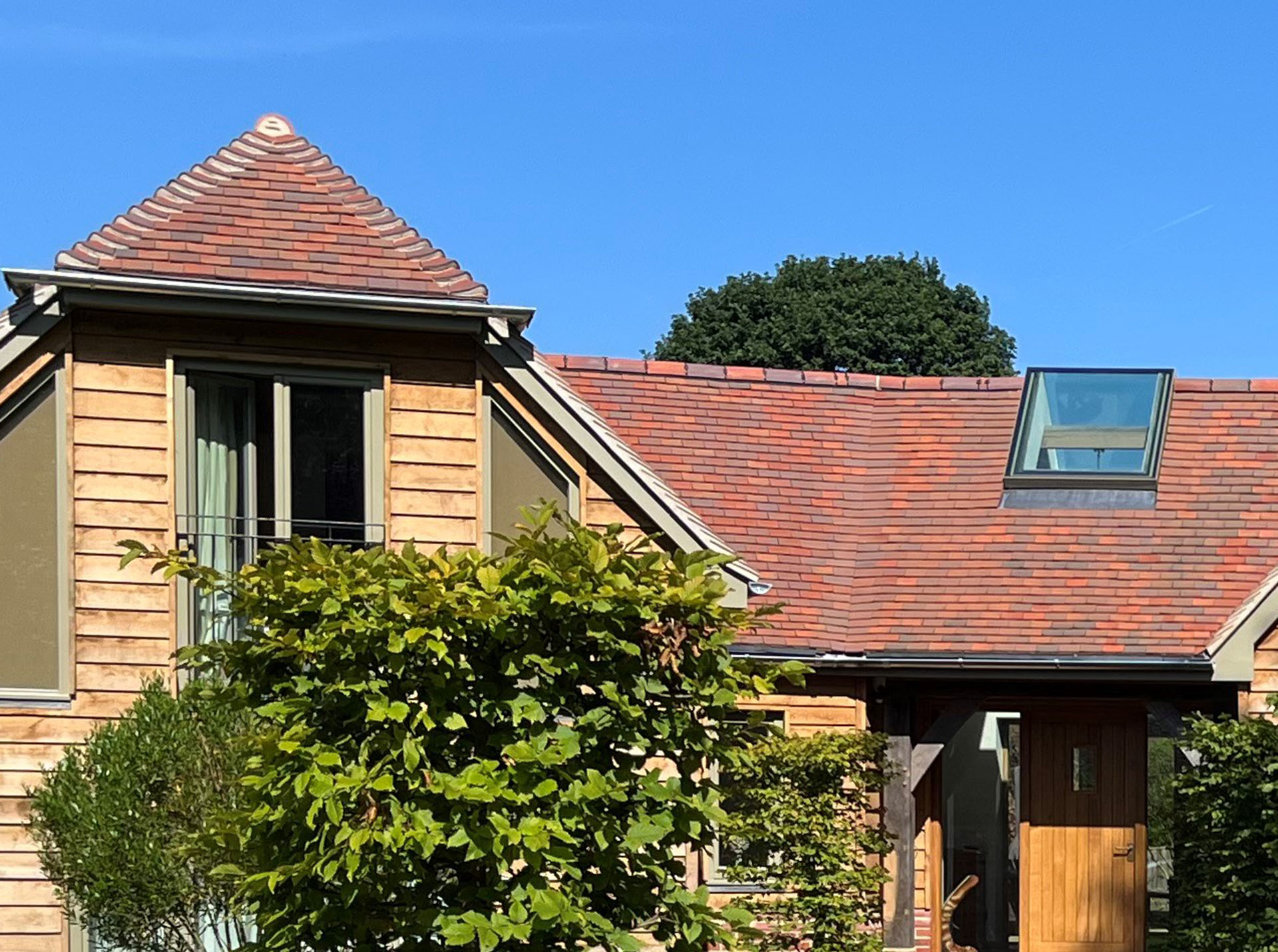 a mixed blend of bronze purple brown handmade tiles on a residential project in Surrey