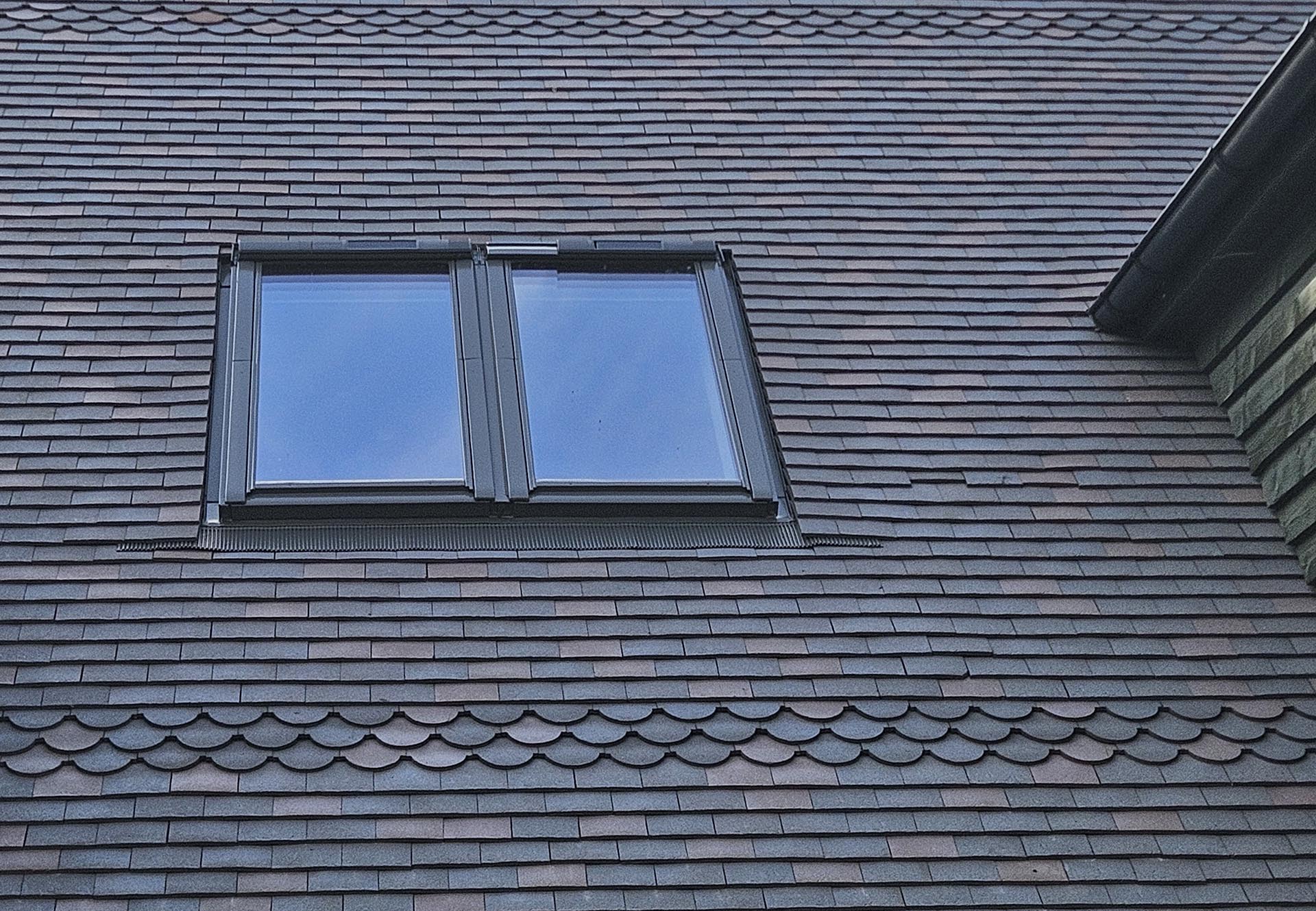 a mixed blend of dark heather and Staffs blue tiles with bands of ornamentals