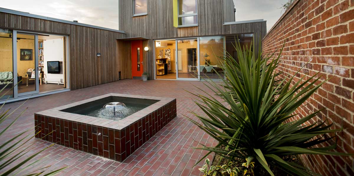 a mixed blend of light and dark multi quarry tiles at a Passiv house in Hampshire