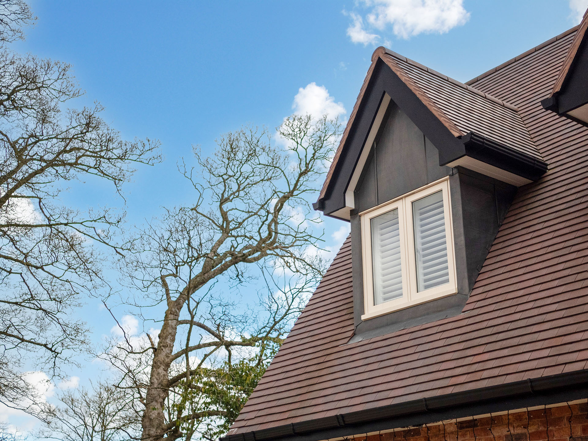 a new build house by Mercia Design Build with dark heather tiles