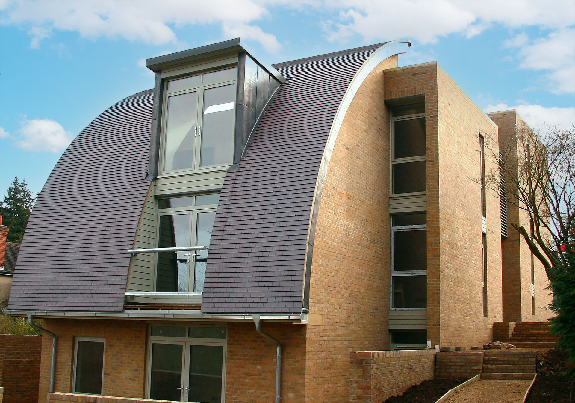 an award winning project by Adrian James Architects with blue brindle clay tiles