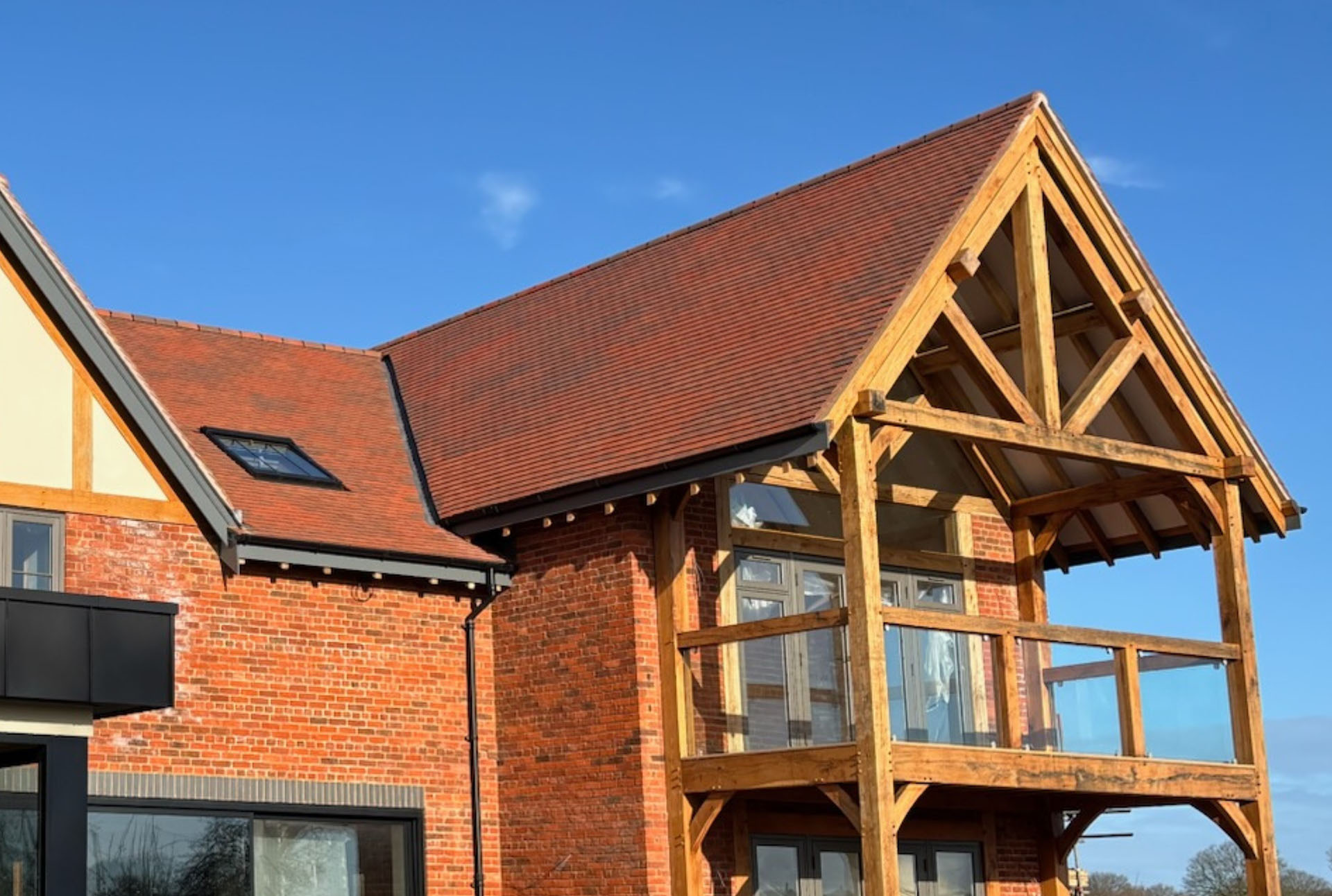 brown antique rustic tiles on a new build house by Levison Rose
