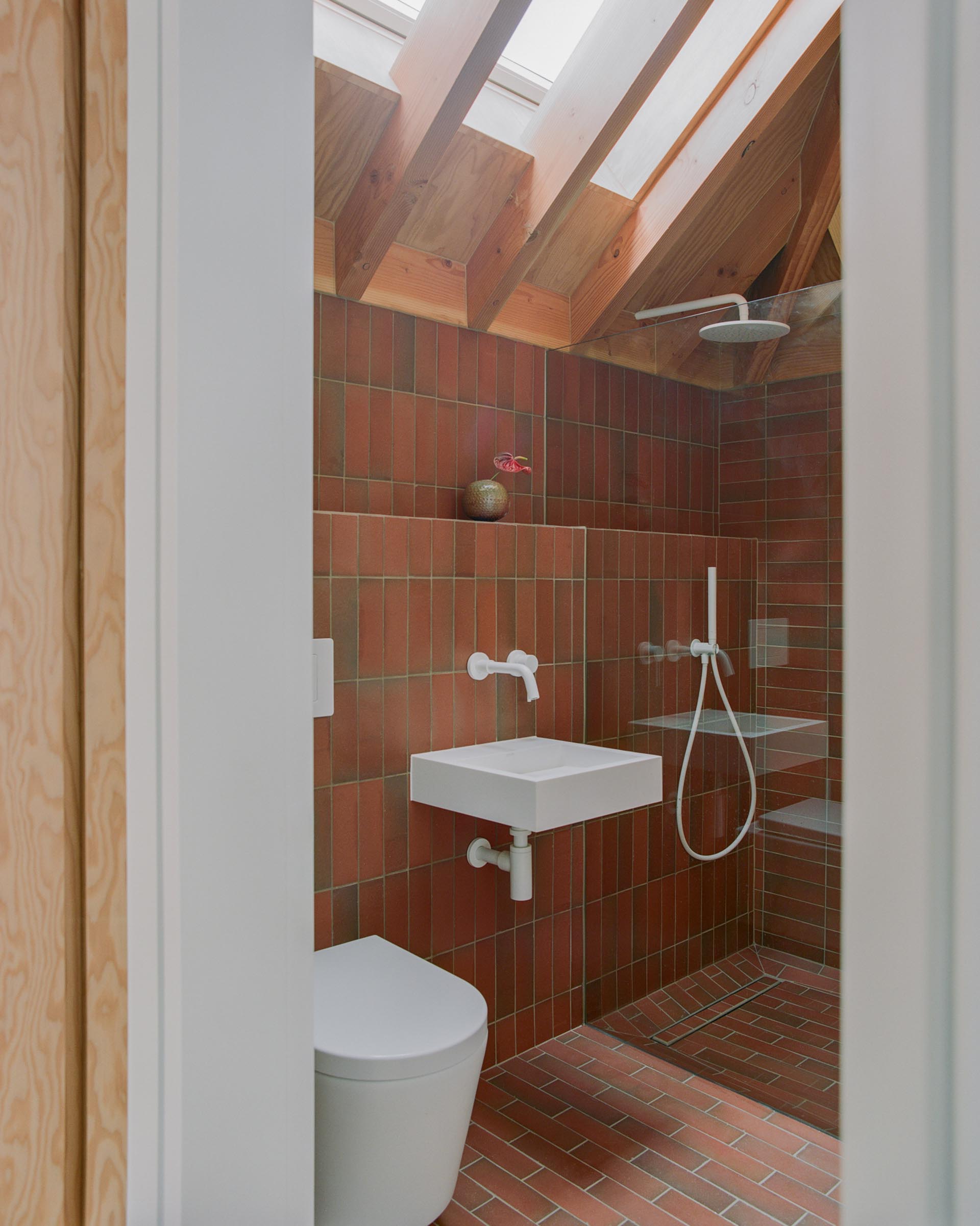 contemporary bathroom with light mult quarry tiles by Wadhal architects Lorenzo Zandri