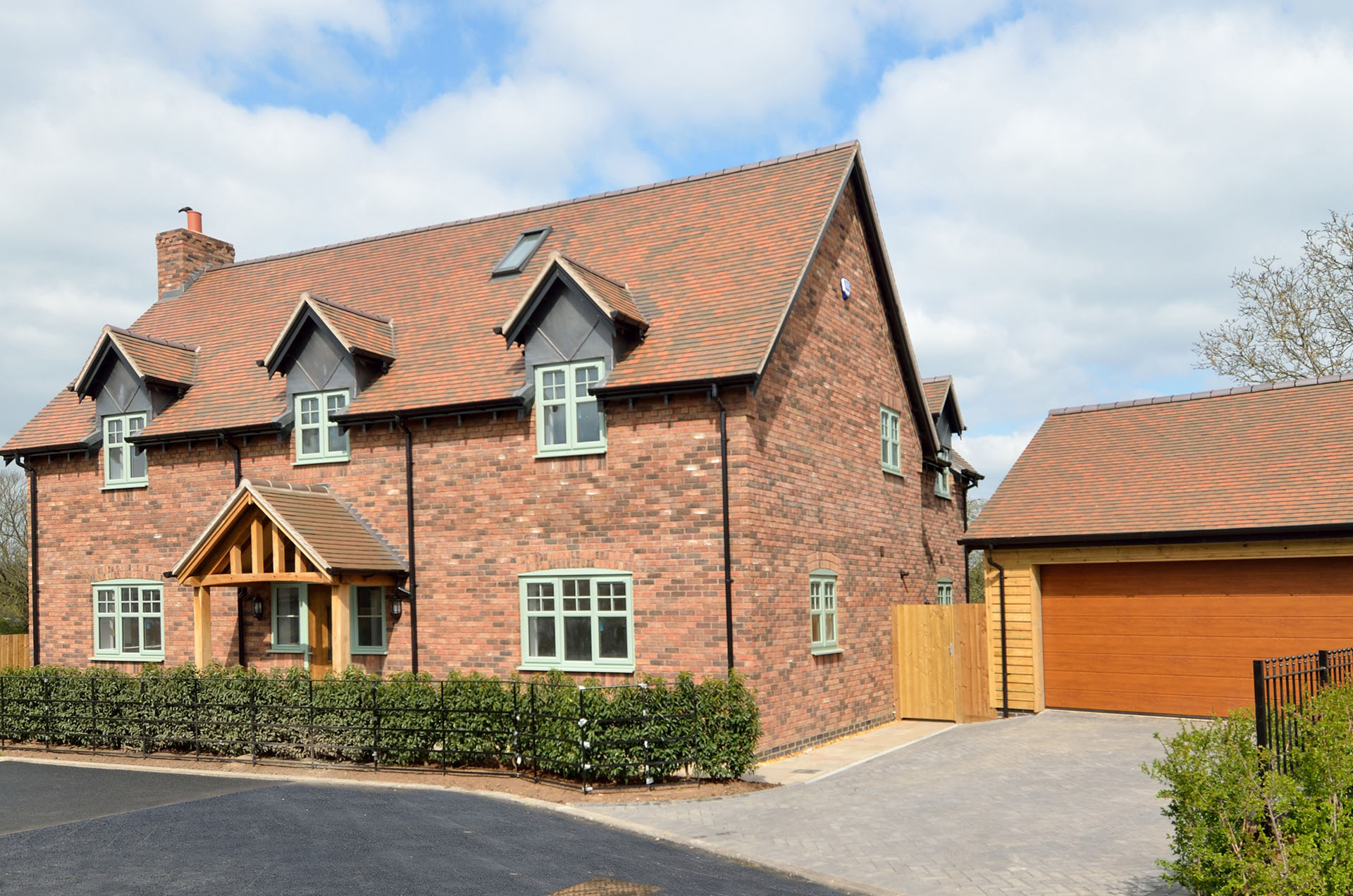 country brown smooth tiles at the Firs a development by Hagley Homes