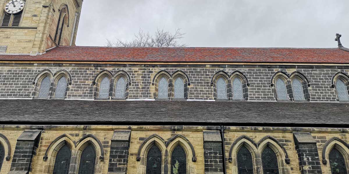 purple brown handmade clay roof tiles for a church reroof