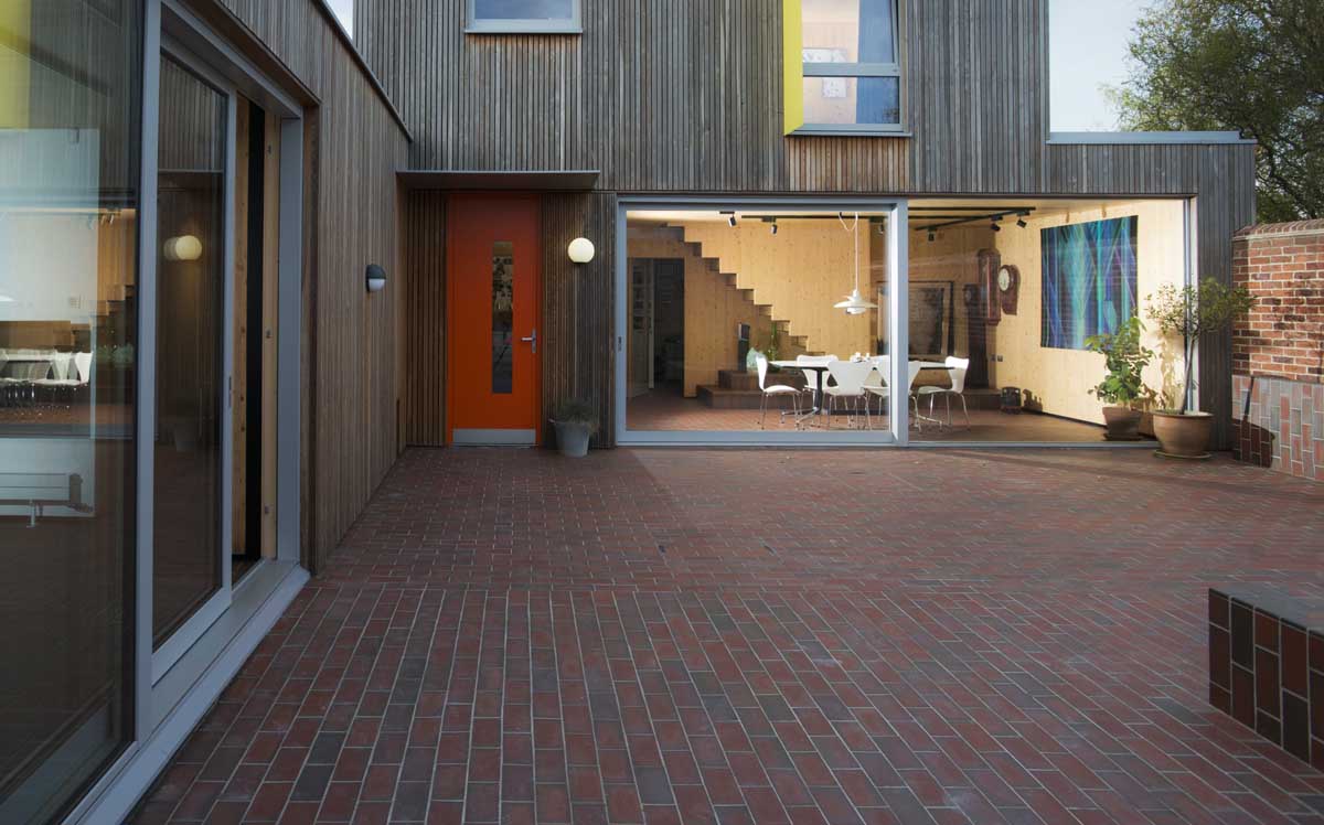quarry tiles in dark and light multi unite the indoor and outdoor spaces