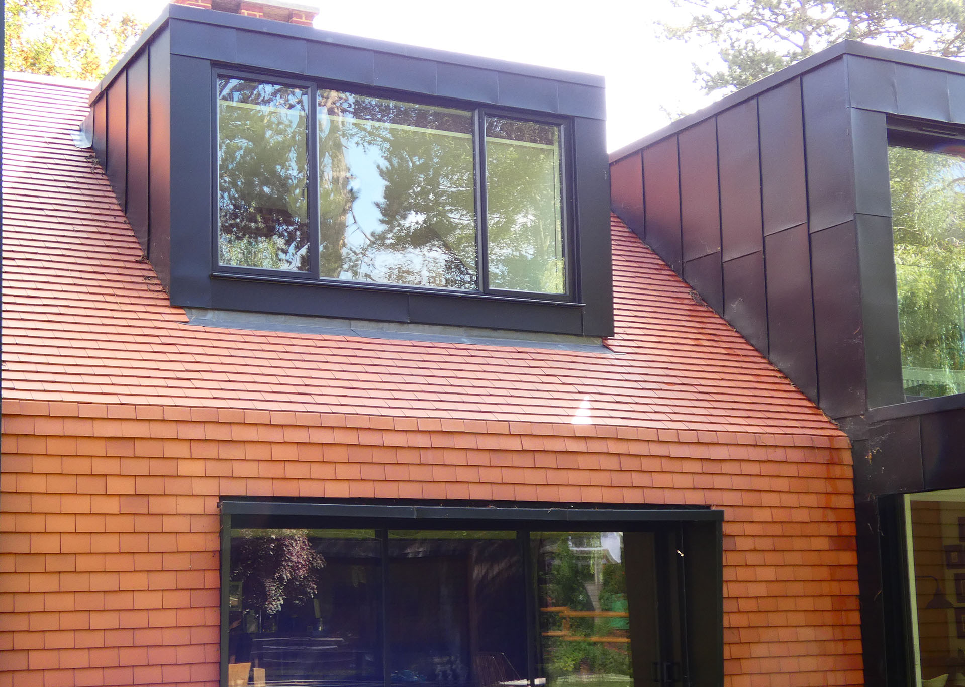 self build project in Purley with Dreadnought red smooth tiles and mansards
